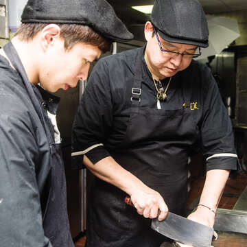 Chen Boxuan (right) is dedicated to carrying on the chef’s spirit and the flavors cultivated through the years by his family.
