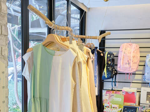 Not only is Joyce expert in children's clothing design, but she also designs dresses for mothers, which are as popular as children's wear in her store.