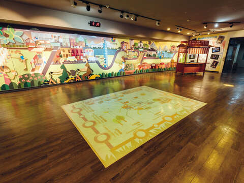 The interactive exhibitions include (but are not limited to) projected board games on the floor and a model of a street food stand.