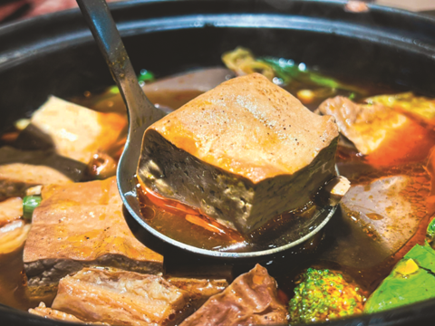 The mala broth seeps into savory stinky tofu and blood curds, making it one of the most popular hot pot options in Taiwan.