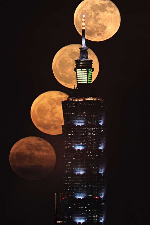 吳昆臻先生拍攝之滿月與台北101大樓