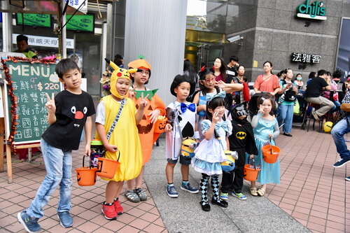 kids dressed up in Halloween costumes